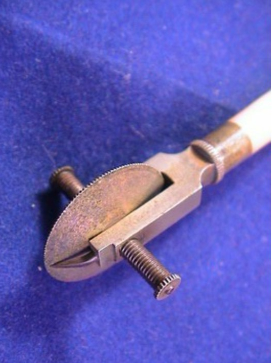 This measure that appeared for sale on an online auction site shows another design of tracking wheel on an Elliott opisometer
