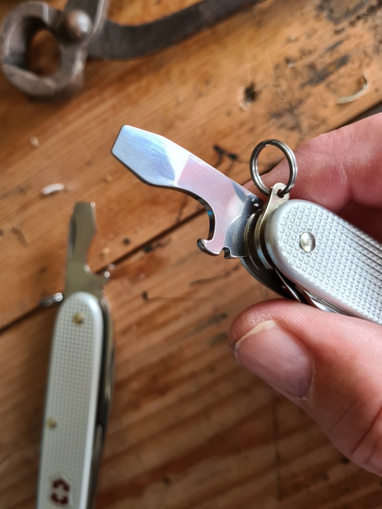 Combination cap lifter and screwdriver on both Pioneer X and Farmer