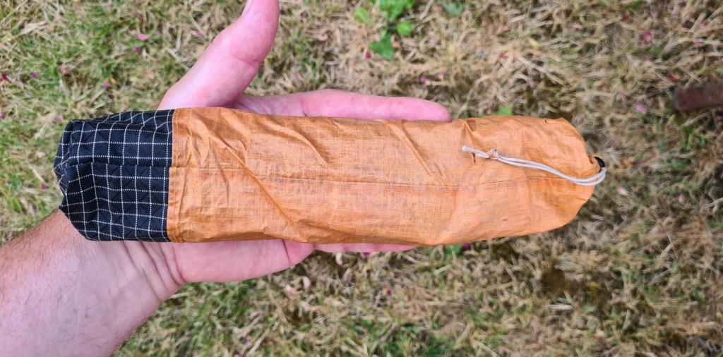 Pegs are carried in a small bag made of DCF or some other lightweight material. A plastic bag would suffice for this