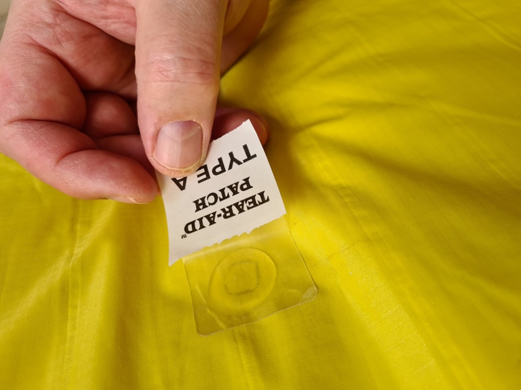 Apply repair patch, keeping glue dot central