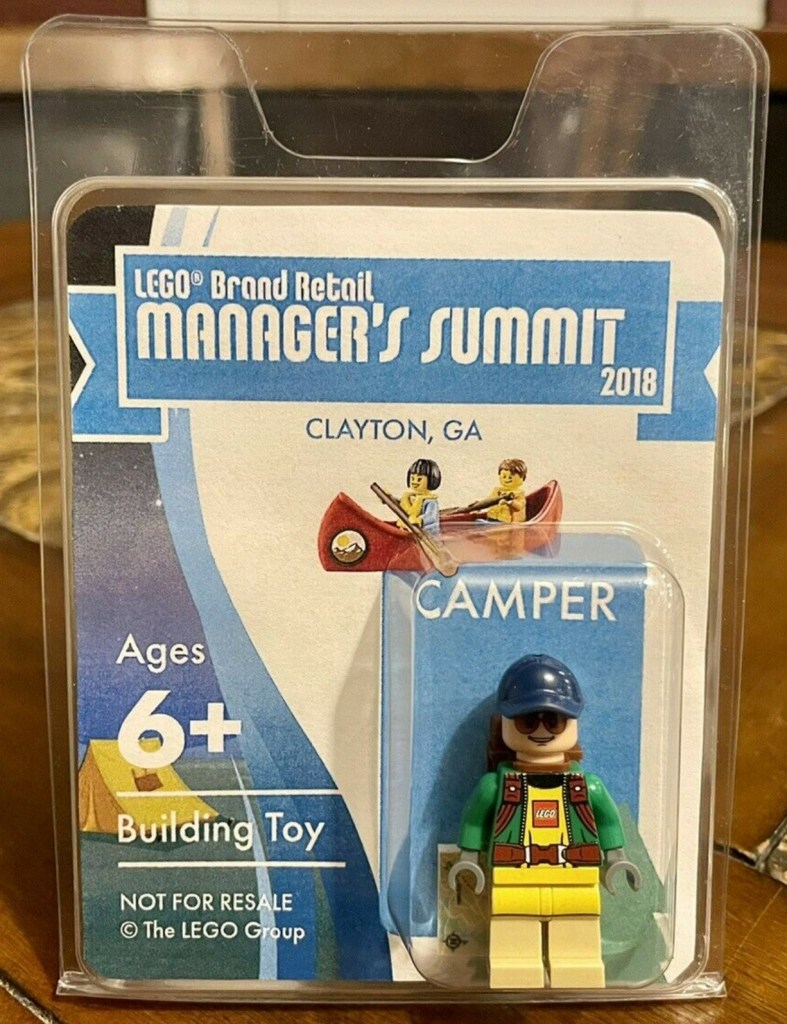BRMC 2018 Lego Camper. Image from eBay. Each figure came in special clamshell packaging. He also has a small map tile showing the air route to the Lego conference