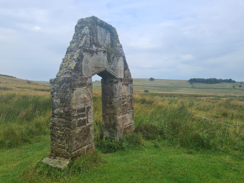 All that remains of New House, built by Robert Parker in the 1670s. Mostly demolished in the 1920s, stone was taken for nearby buildings. Barely legible on the lintel are the words: “Robert Parker and Jane his wife, May 2nd 1672”