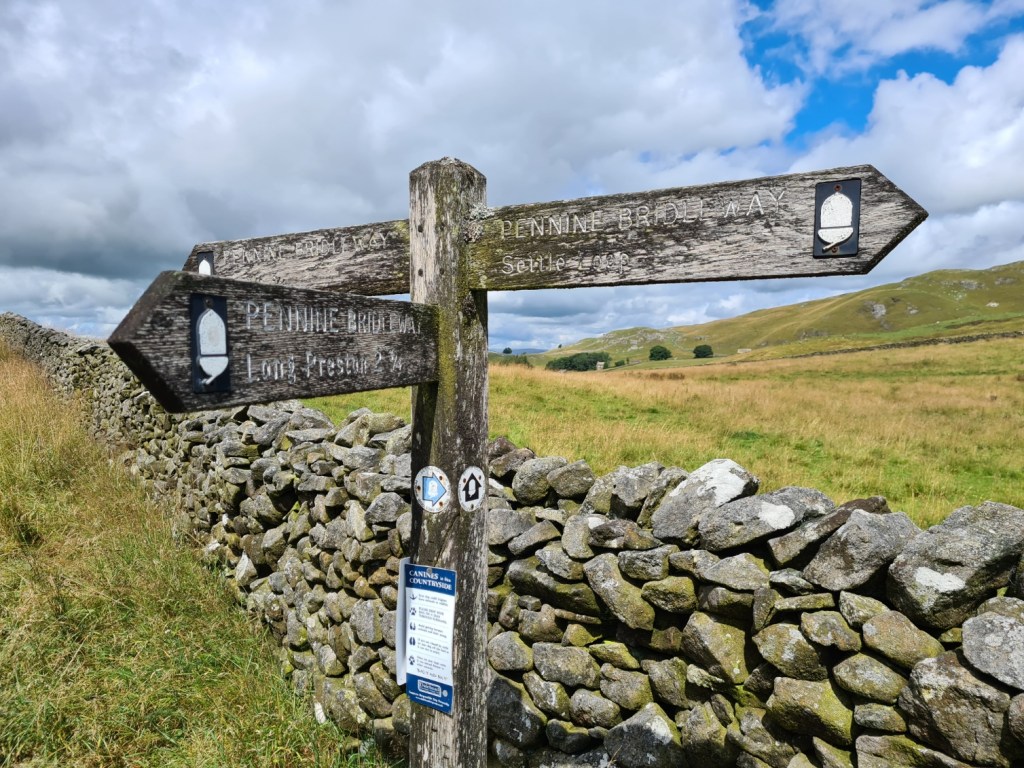 Pennine Bridleway signage at the junction for the Settle Loop