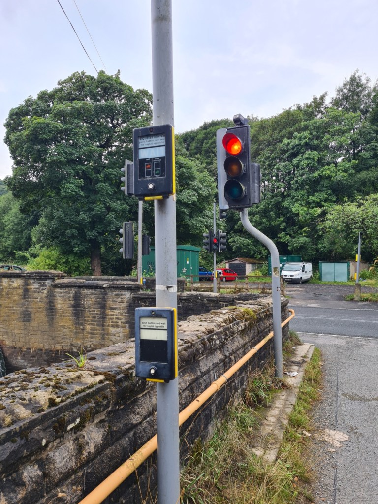 Two level buttons for crossing, lower for pedestrians, upper for equestrians