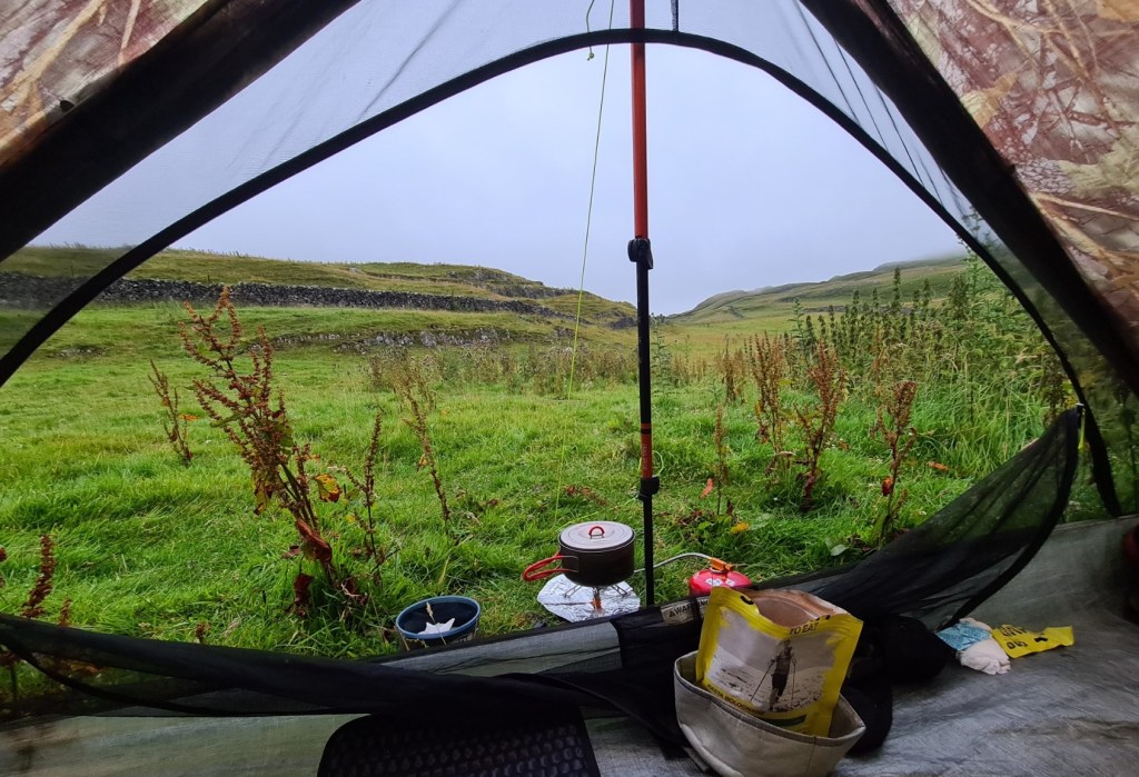 Weather is closing in, time to heat water for a meal and brew before battening down the hatches