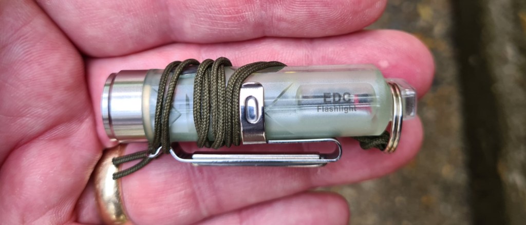 Three Points of the Compass has now looped a short piece of cordage through the keyring. This allows the light to be hung round my neck, or looped around my hand for additional security