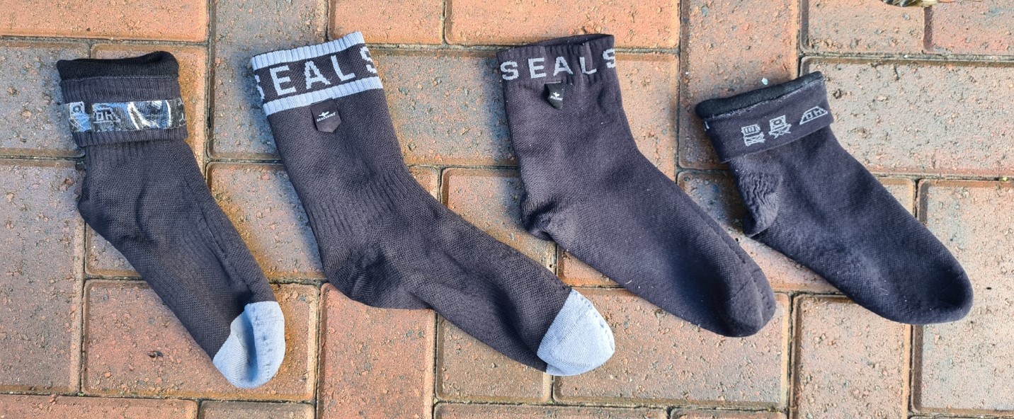 Sealskinz waterproof socks. Ankle length Warm Weather with Hydrostop, and the simpler and lighter ankle sock design that preceded them
