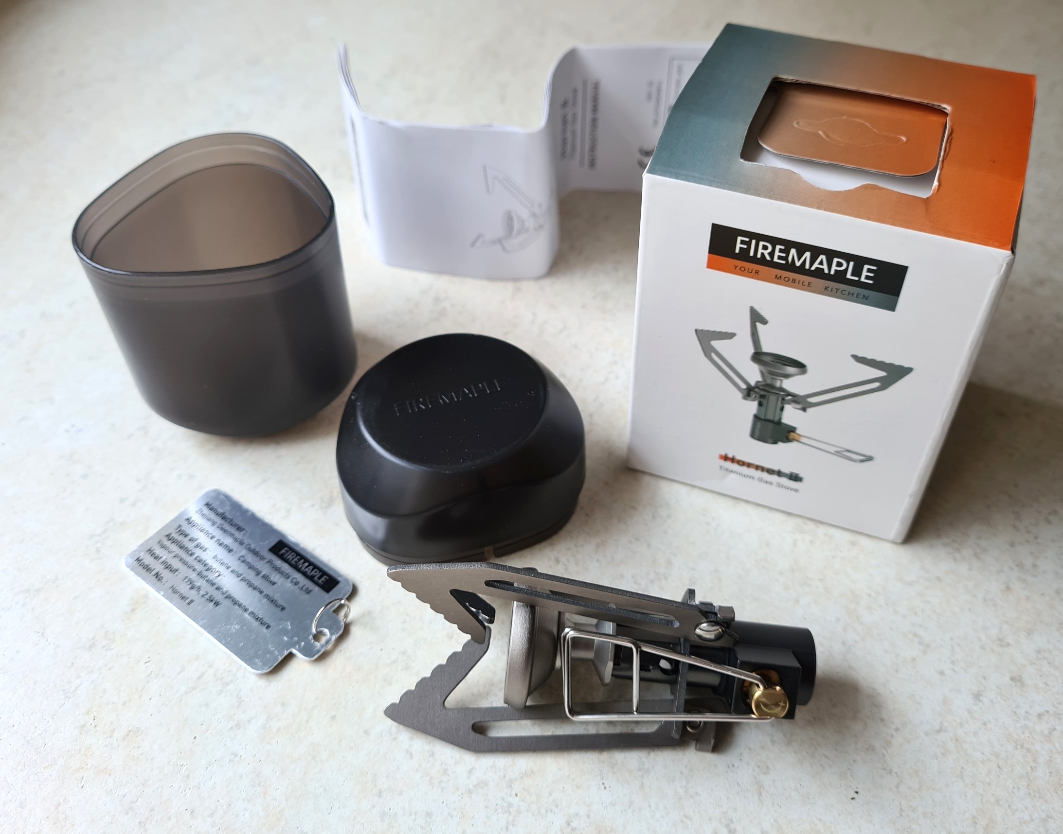 What you purchase- Hornet II gas stove, fuel usage tab (attached to valve control), rigid plastic case with lid, instructions, all in card box