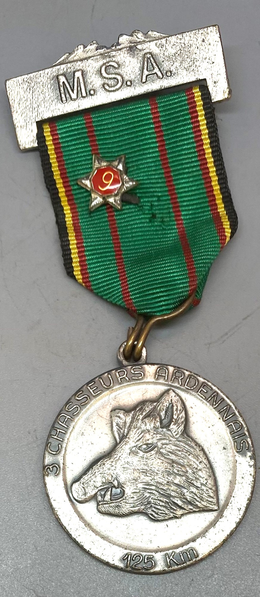 M.S.A. medal. With red number 9 star on ribbon