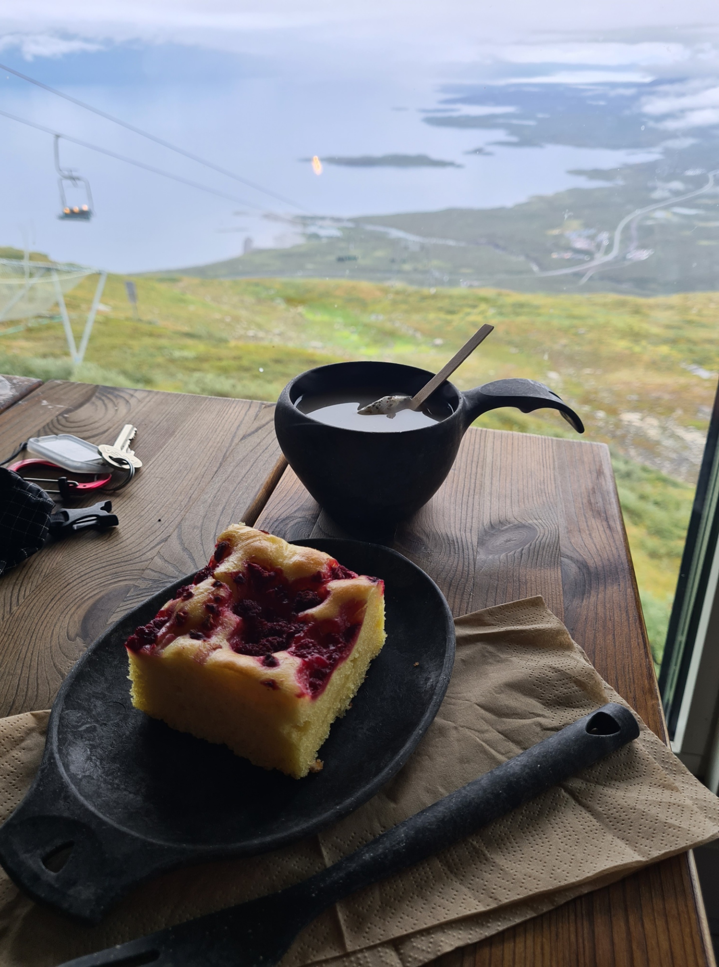 Swedish Fika at the mountain station on Njulla. This occasionally operates as a restaurant. They turn the lights off and the place is lit by the Aurora borealis