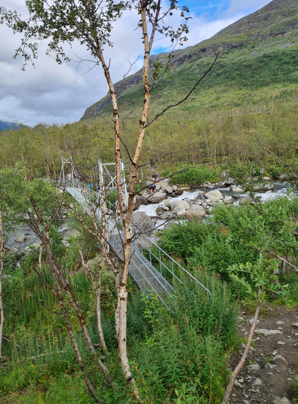 Descending to the suspension bridge over the Siellajohka. Wilcamping on the far side is permitted but beyond that, it is the Abisko National Park