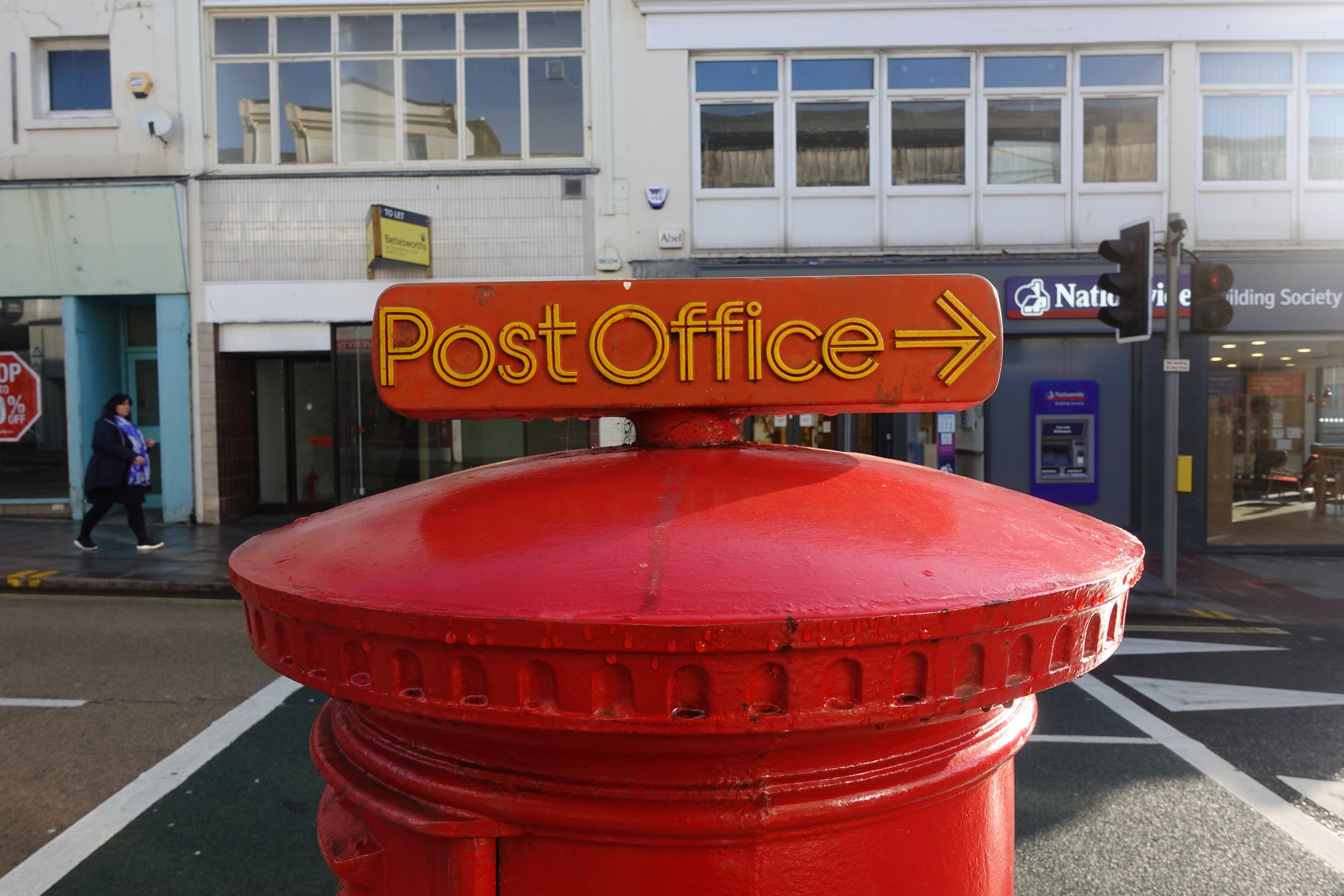 This GvR pillar box was photographed at Torquay, on the South West Coast Path. Beside a Post Office Direction, it also shows the standard fluting found around the rim of the cap