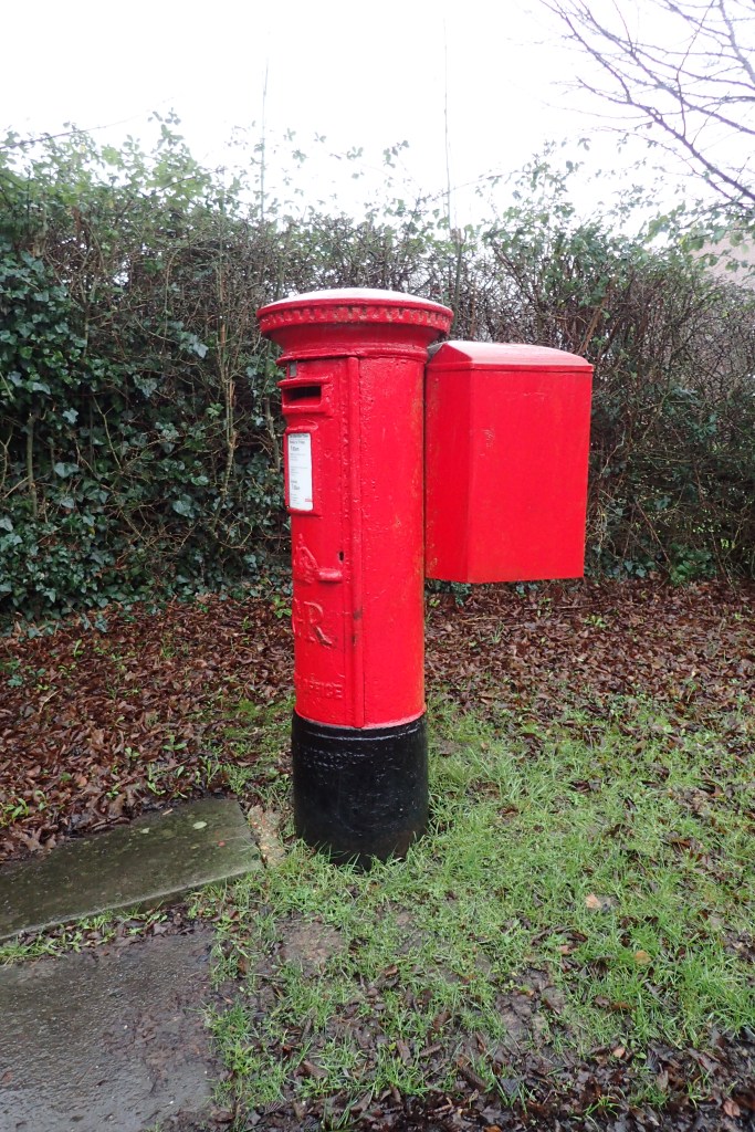 Pillar box near Moor Park suffers the ignominy of having a pouch box bolted to it's rear