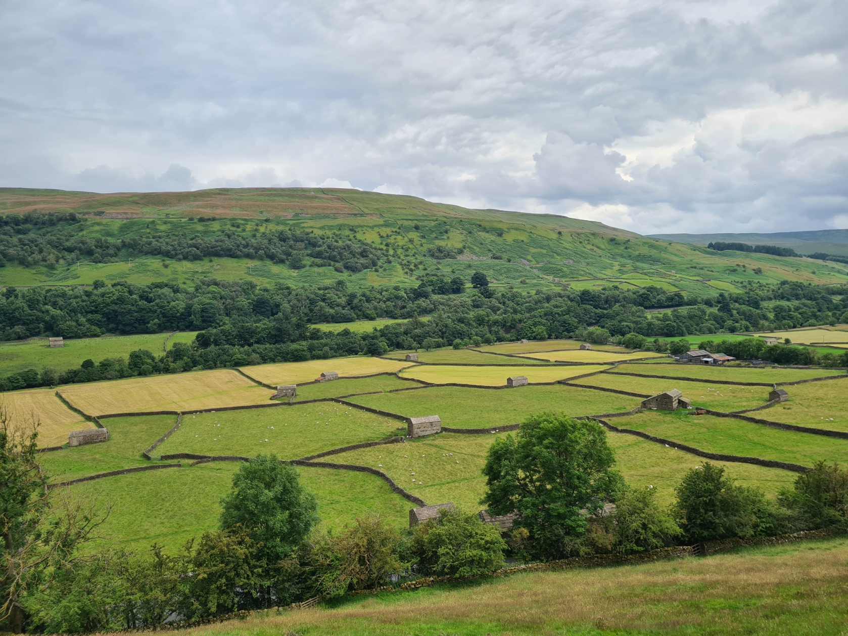 fields and stone buildings