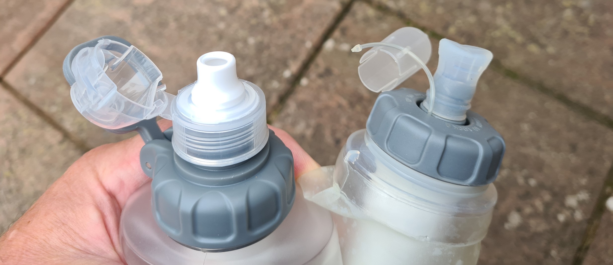 Flip sportscap on left is a welcome improvement on the simpler, though lighter, original mouthpiece from Pure Clear