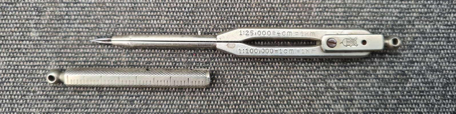 Two scales are shown on the side of the Ecobra dividers, with protective sheath removed