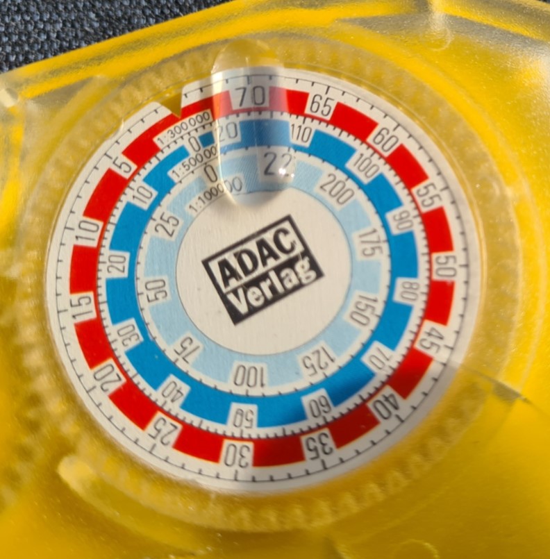 Measuring dial has three scales and a small magnifier