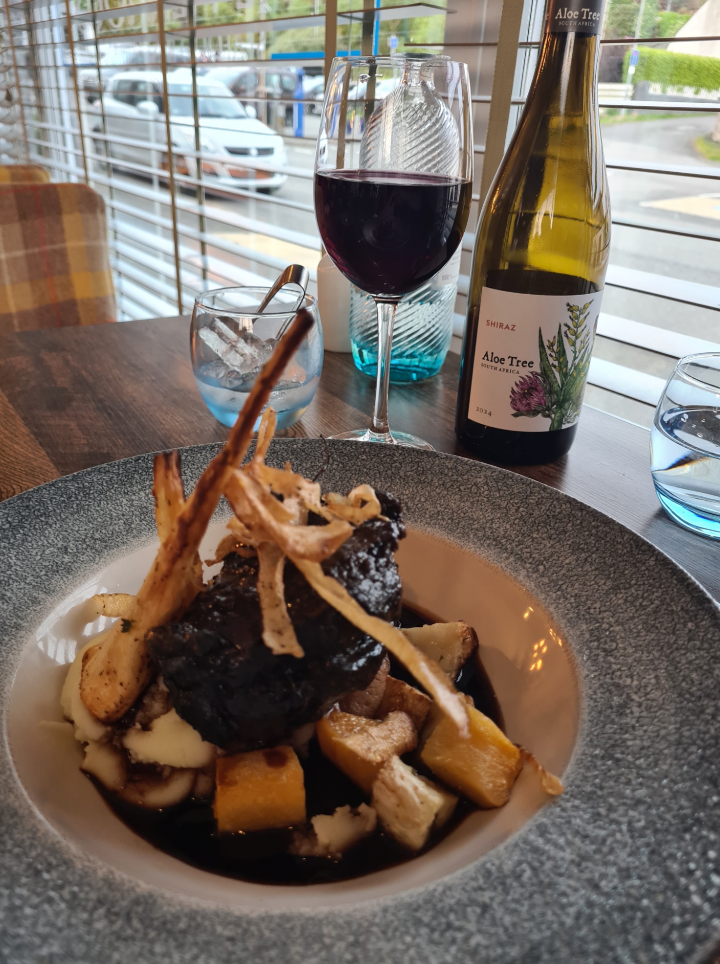 Slow roasted, Ox Cheek, horseradish mash, roasted parsnip, celeriac, crispy kale and jus